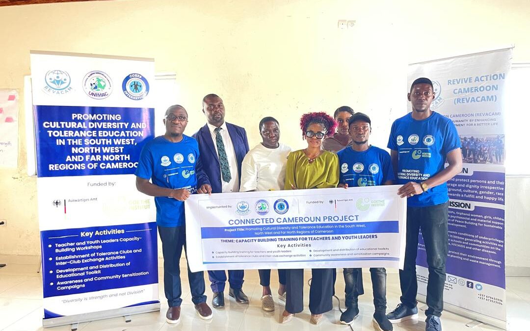 Young Teachers with banner