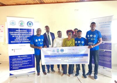 Young Teachers with banner