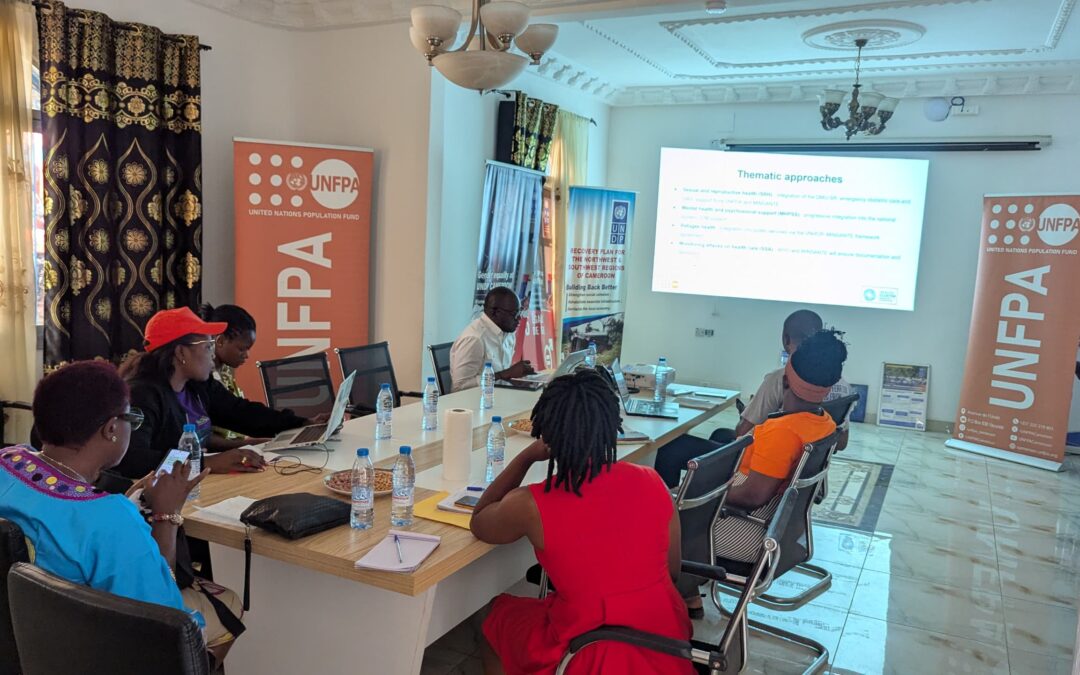 Participants watching presentation