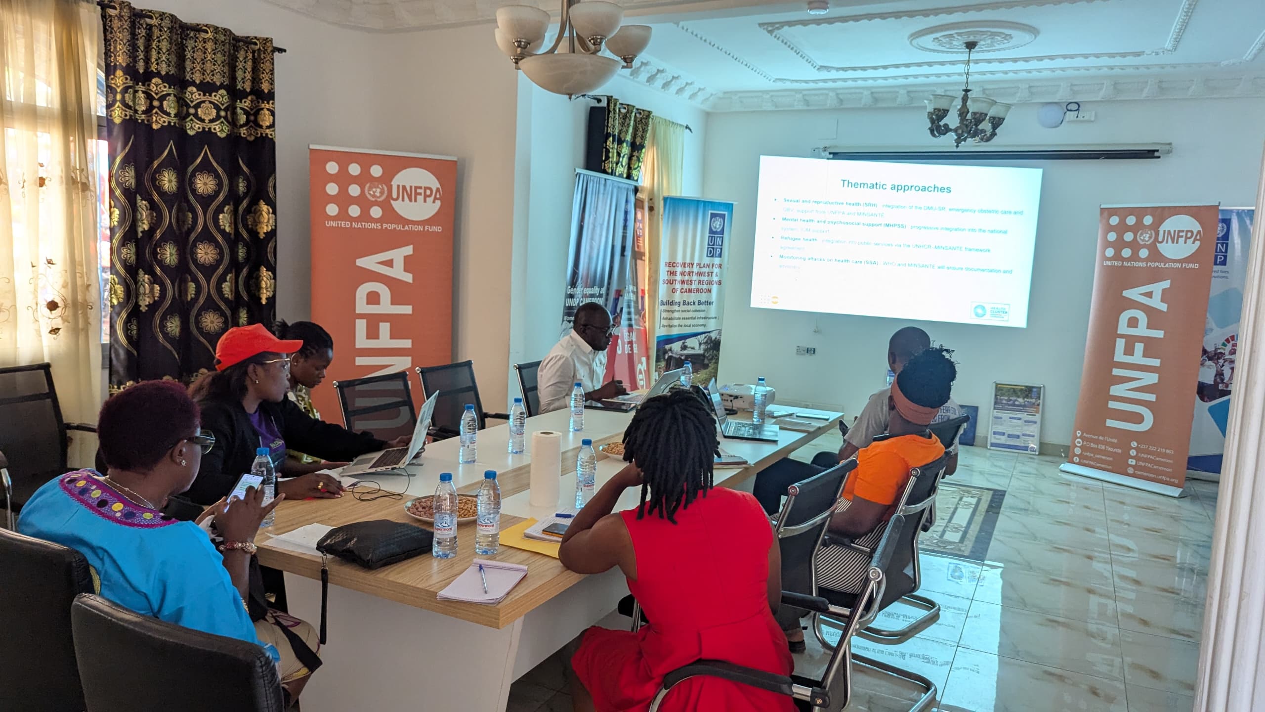 Participants watching presentation
