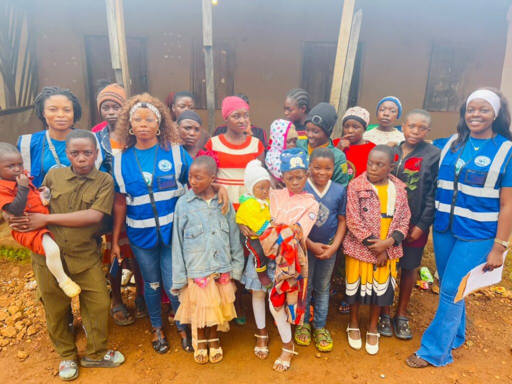 Children and young people of Njong Village who took part in the needs assessment, with UNIMAC staff