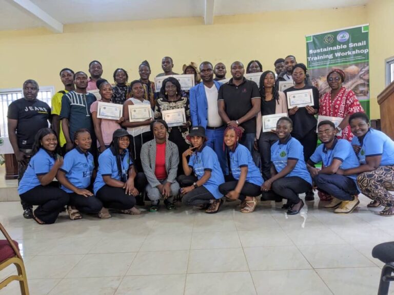Participants of the UNIMAC Sustainable Snail Training Workshop posing with their certificates