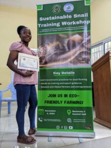 Participant holding her snail training certificate